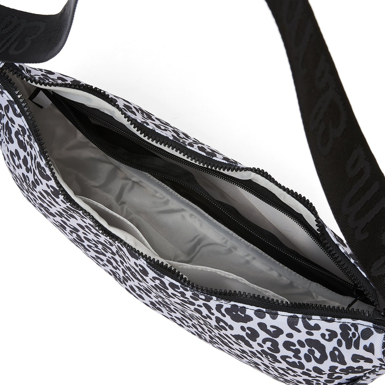 Ela Mo™ Moon Bag | Leo. Innenbereich der Umhängetasche mit kleinem Fach und Reißverschluss innen.