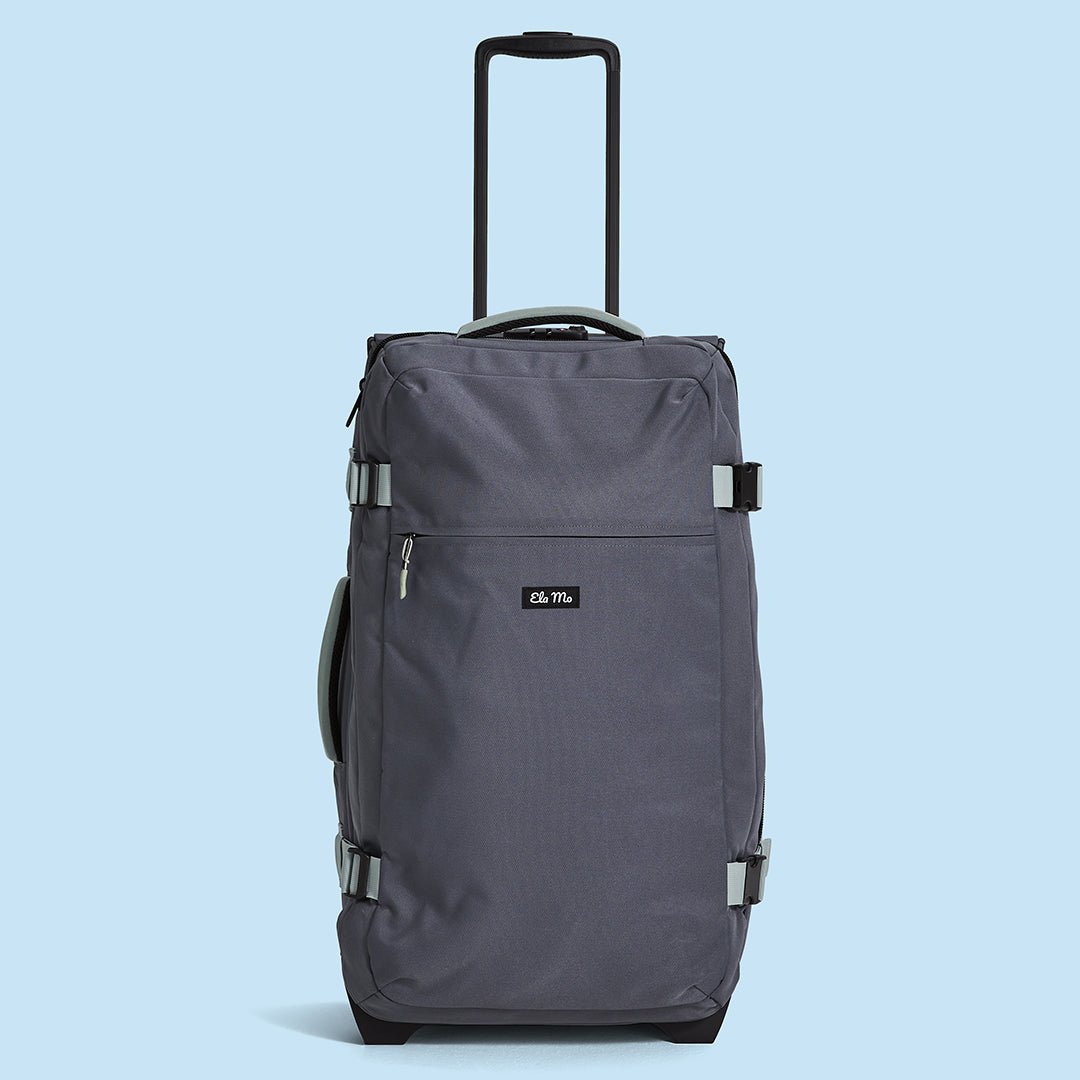 Ela Mo™ Reisetasche mit Rollen 78 Liter | Darkgrey Mint. Eine Reisetasche mit hochgezogenem Griff und Außenfach.