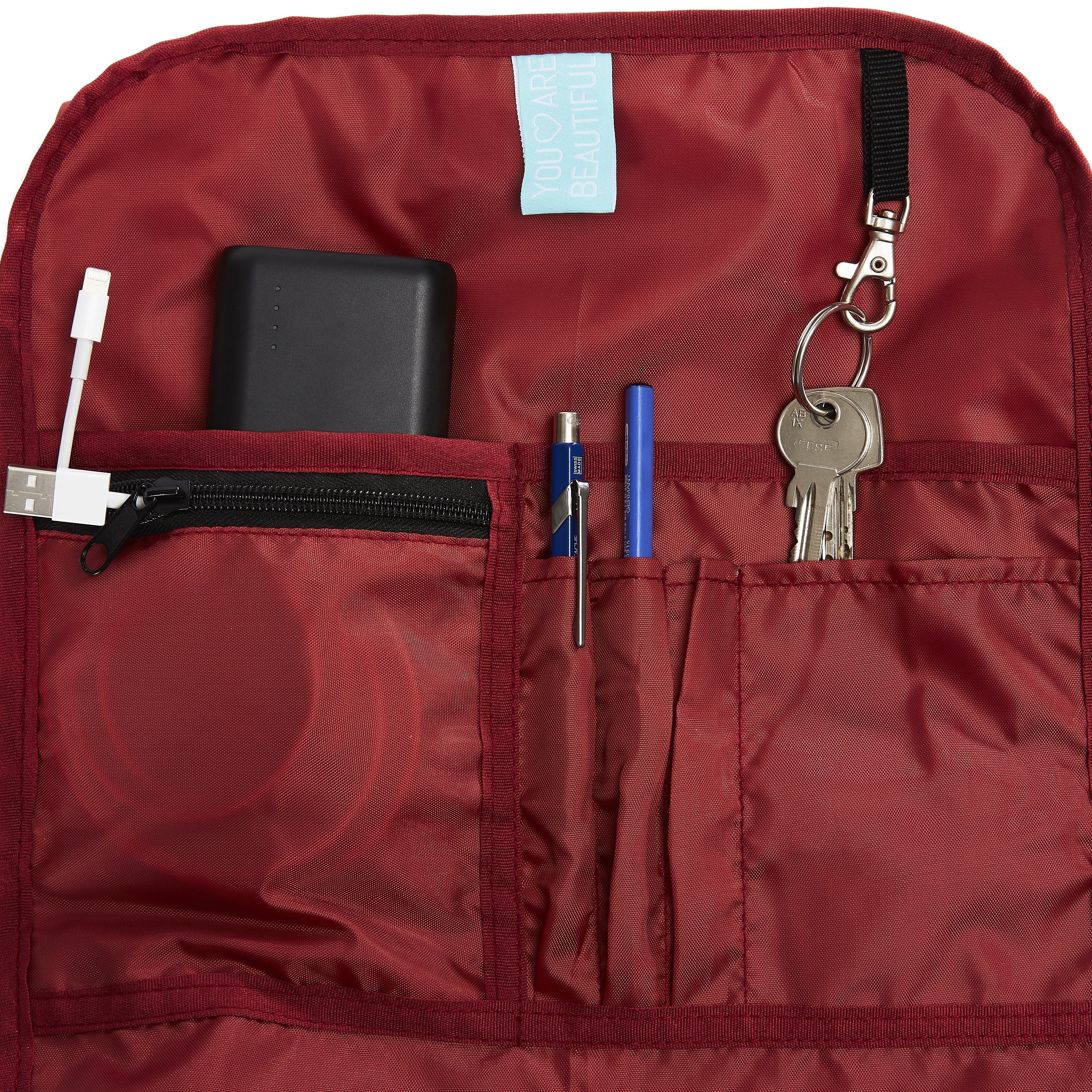 Ela Mo™ Rolltop Rucksack | A Rose. Innenbereich des Rucksacks mit kleinen Fächern und Schlüsselanhänger.